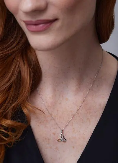 Close up shot of red haired model wearing 10ct Gold 